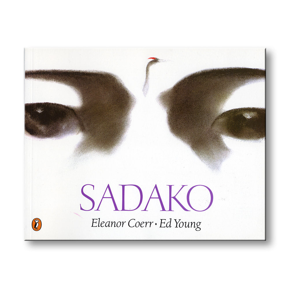 Book cover of 'Sadako' by Eleanor Coerr and Ed Young with a close-up of eyes and a red hairpin.