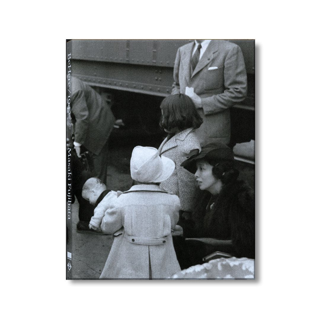 Cover of exhibition catalog depicting a photo by Dorothea Lange of Japanese American family at a train station.