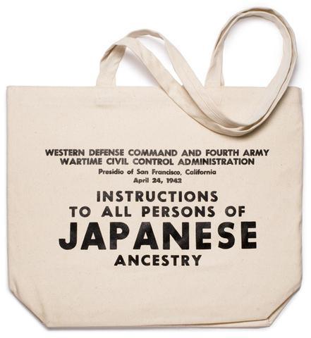 Natural canvas tote bag with "Instructions to all persons of Japanese Ancestry" printed in black.