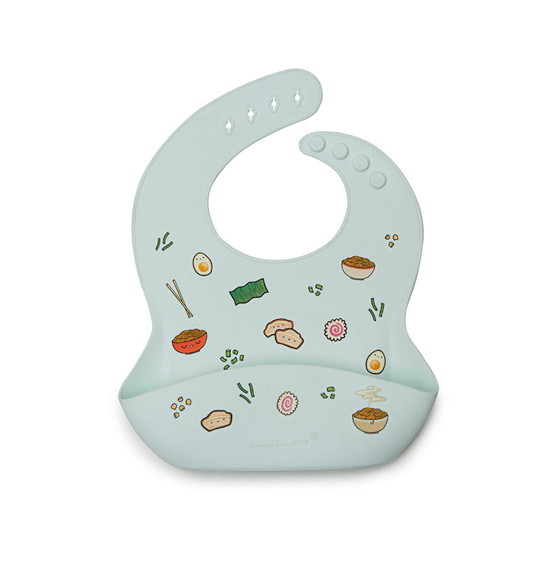 silicone baby bib with drawings of ramen ingredients and accessories.